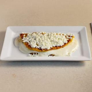 Cachapas with Queso de mano (Sweet Corn Pancakes with soft white cheese)